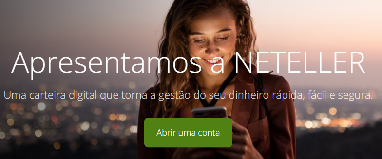 Abra o site da Neteller Brasil e na tela principal, clique em “Abrir uma conta” ou “Associe-se gratuitamente”
